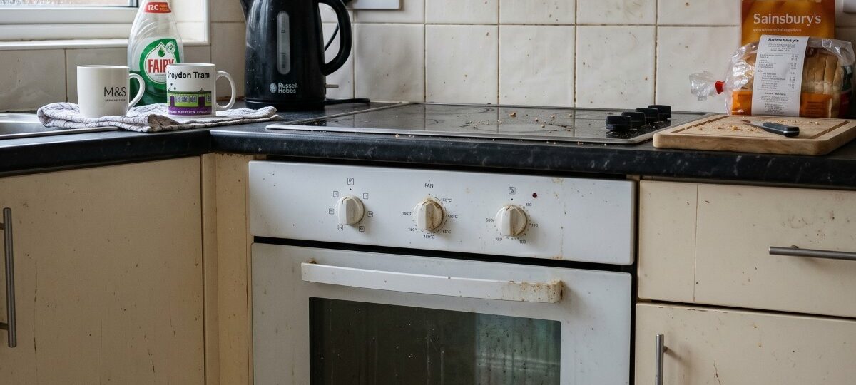 a slightly neglected home oven in a modest middle-class kitchen in Croydon, South London